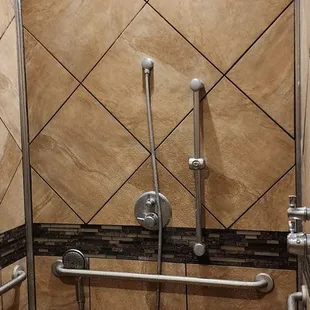 a shower in a tiled bathroom