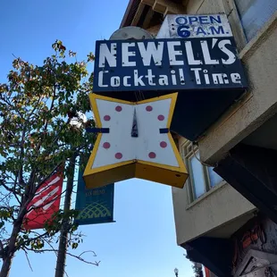a neon sign for a cocktail bar