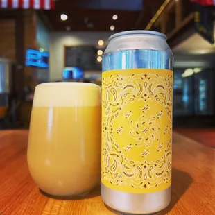 a can and a glass of beer