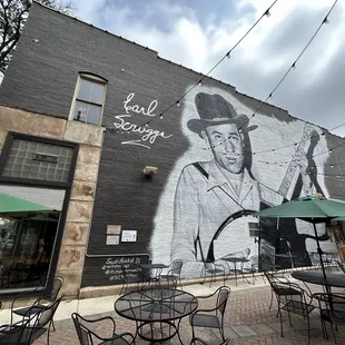 a mural of a cowboy on the side of a building
