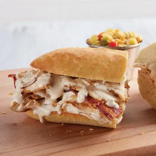 a chicken sandwich on a cutting board