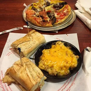 The deluxe pizza, Newks Q, and baked mac n cheese
