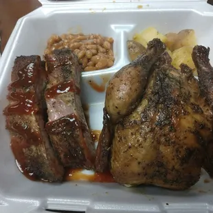 a chicken and beans in a styrofoam container