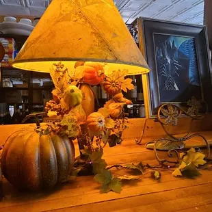 a table with a lamp and a globe