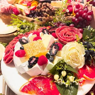 a platter of fruit and cheese