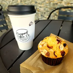 a muffin and a cup of coffee