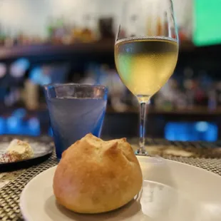 a glass of wine and a plate of food