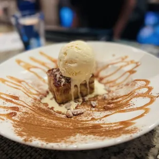 a dessert with ice cream and caramel sauce
