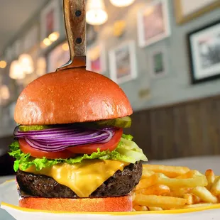 a hamburger and fries on a plate