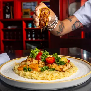 GRILLED MAHI MAHI: Fresh Locally Caught Mahi Mahi, Creamy Lemon Risotto, Brown Butter Sauce &amp; Tomato-Herb Salad