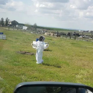 a beekeeper in a bee suit