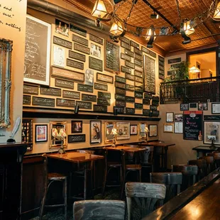 Interior wall of signatures at Newsroom Pub