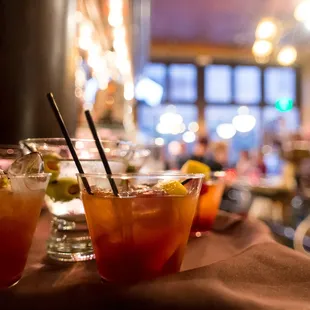 a row of cocktails on a table