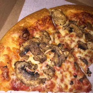 a slice of mushroom pizza