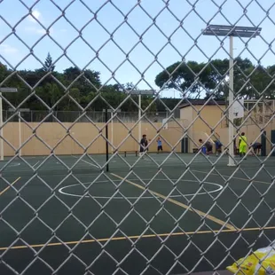 Basketball courts with adjustable rims