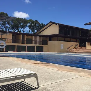 Pool wit lounge chairs and lifeguard stand