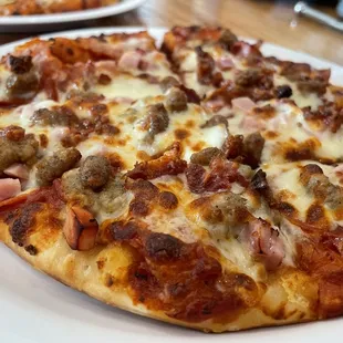 a pizza on a white plate