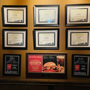 a wall of award plaques