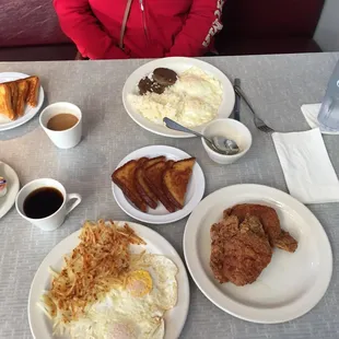 Breakfast; pork chops, eggs, hash browns and toast...eggs, rice, sausage and toast