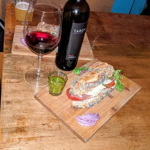 a sandwich and a glass of wine