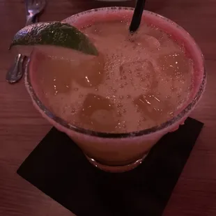 Mango margarita on the rocks with a salt/Tajin rim.