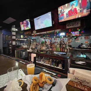 a plate of doughnuts and a glass of orange juice