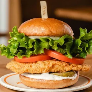 a chicken sandwich with lettuce and tomato