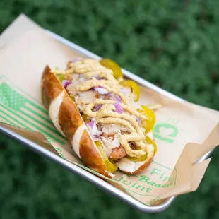 a hot dog with mustard