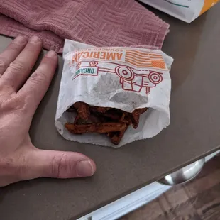 $7 large sweet potato fries.  They're definitely fries and sweet potato. Not so sure about the large part.