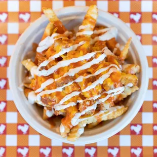 a bowl of cheesy fries