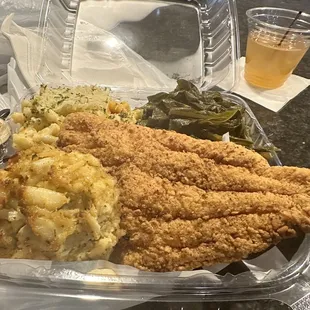 Catfish, crab cake, Collard Greens and Mac n cheese and corn bread.