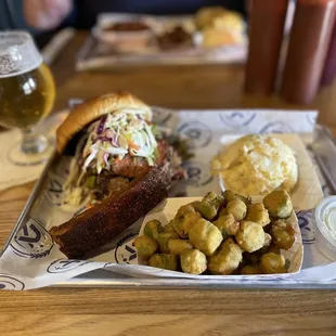 a plate of food and a glass of beer