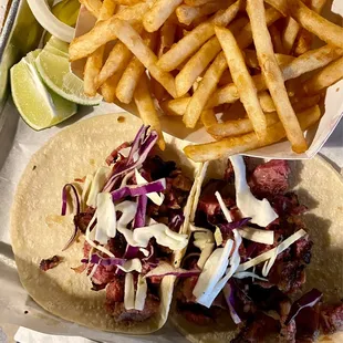 Three 3 Brisket Tacos with a side of Beer Battered Fries