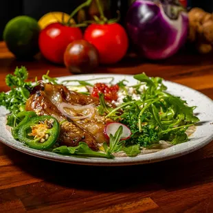 a plate of food on a wooden table