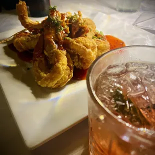 a plate of fried food and a drink