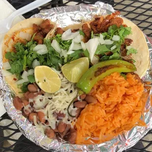 3 pastor tacos with rice &amp; beans ($7), plus a grilled Serrano pepper from Raul!