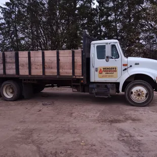 a truck loaded with wood
