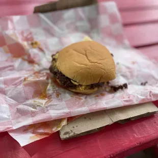 a hamburger on a paper wrapper