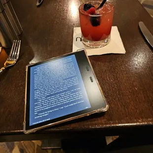 a tablet and a drink