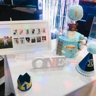 a table with a cake and hats