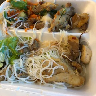 chicken, noodles and vegetables in a styrofoam container