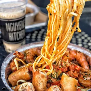 a bowl of noodles and shrimp