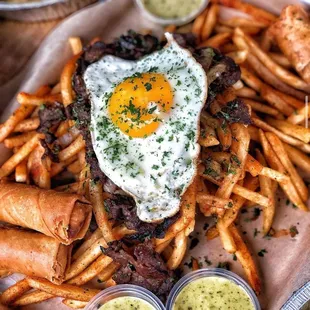 a plate of fries and a fried egg