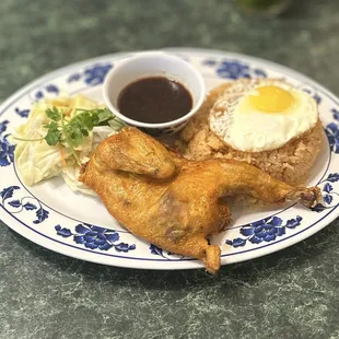 1. CƠM GÀ CHIÊN + Trứng Ốp La: Fried Cornish Game Hen w/Red Rice, Sunny Side Up Egg (Sub.), Pickled Veggies &amp; Special Sauce | $10.95