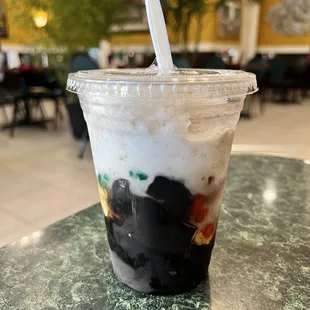 a plastic cup with a straw and a straw in it