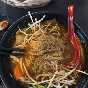 Beef stew pho with noodles and French bread on the side