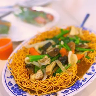 a plate of noodles and vegetables