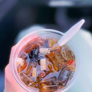 a person holding a drink