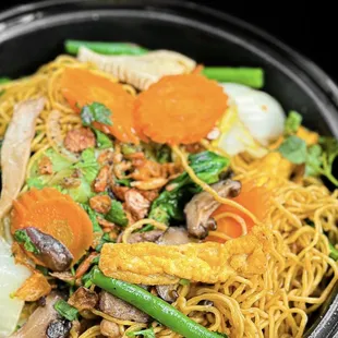 a bowl of noodles and vegetables