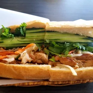 a sandwich with meat and vegetables